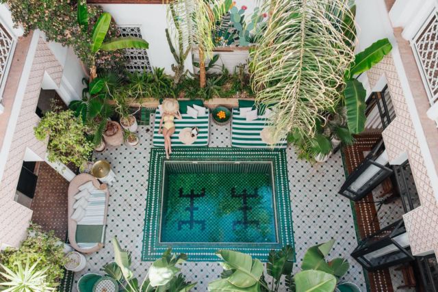 Couple welcomed at a palatial hotel entrance on arrival in Marrakech