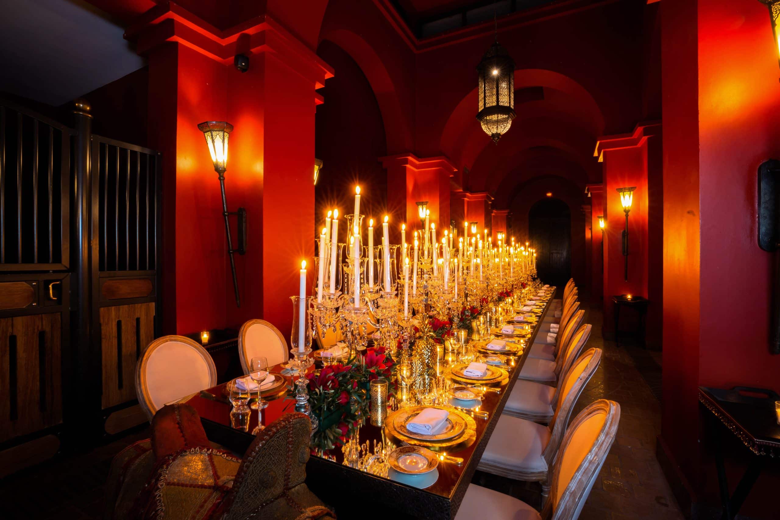 Candlelit private dinner set inside the stables of Selman Marrakech