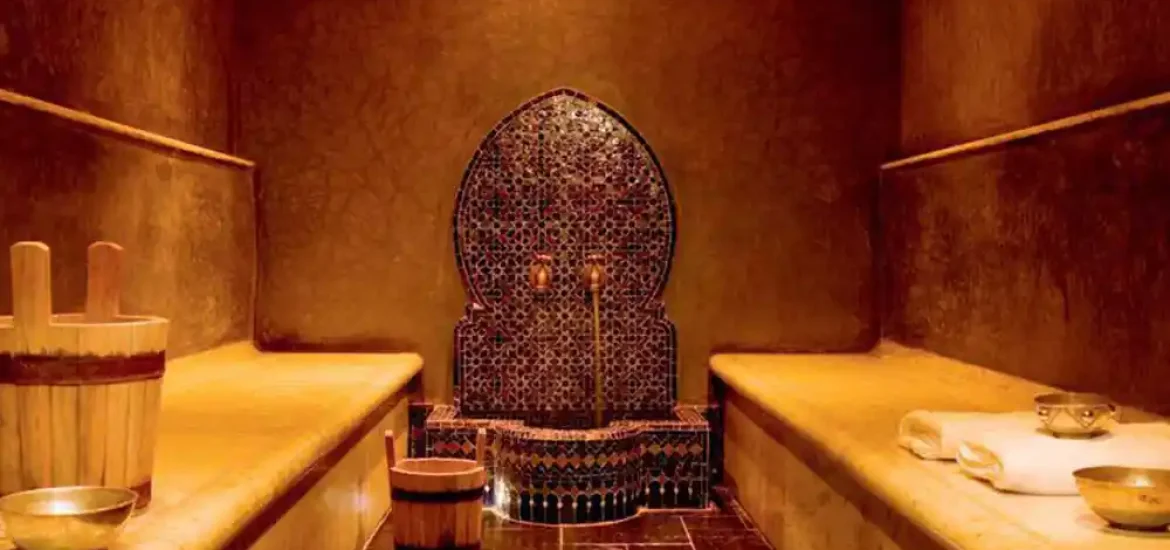 Private hammam ritual with rose petals and traditional spa setting in Marrakech