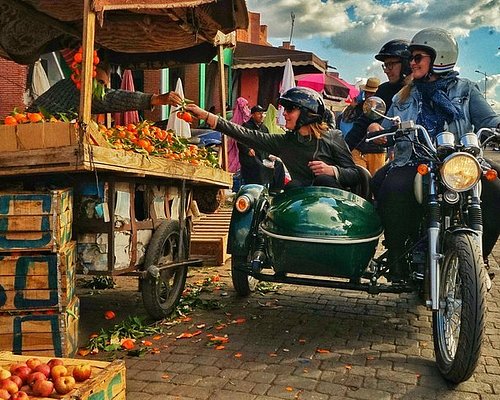 Vintage sidecar ride through the Marrakech palm grove