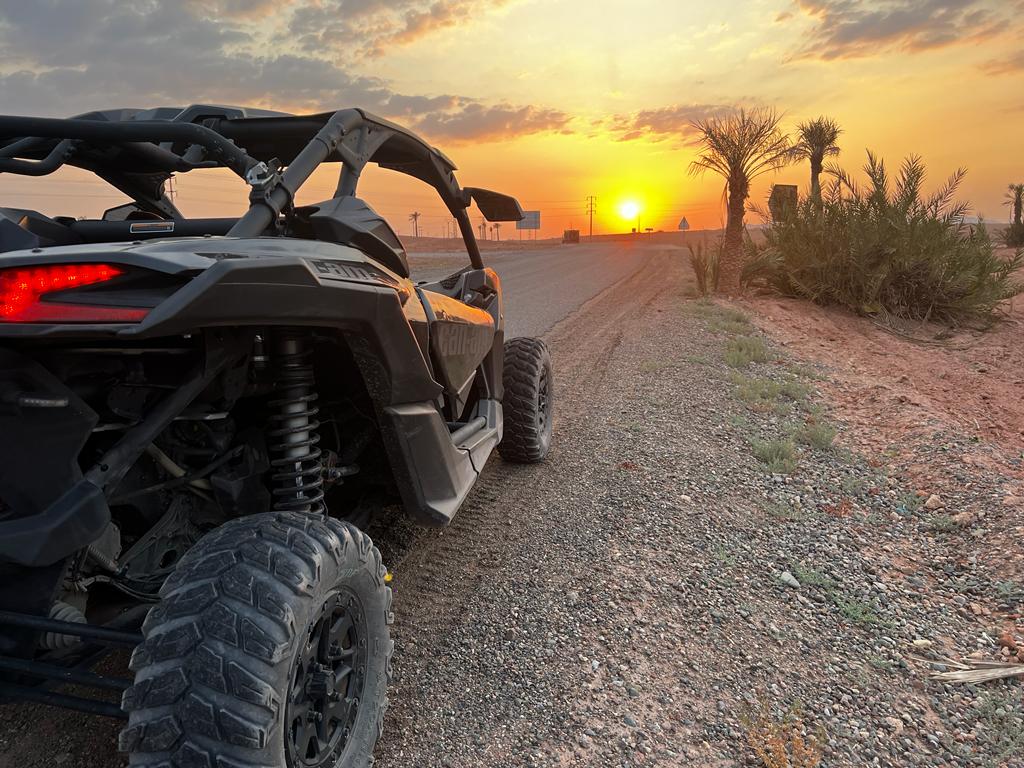 Can-Am Maverick buggy on a desert track at sunset near Marrakech